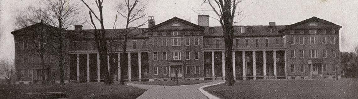 Sepia-toned image of institutional building and front lawns