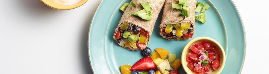 Two veggie wraps and fresh fruit