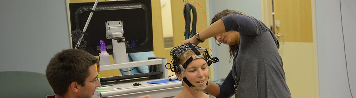 A research participant is prepared for fNIRS.