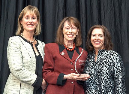 Trautman, Grady with glass flame-shaped trophy, and Breslin