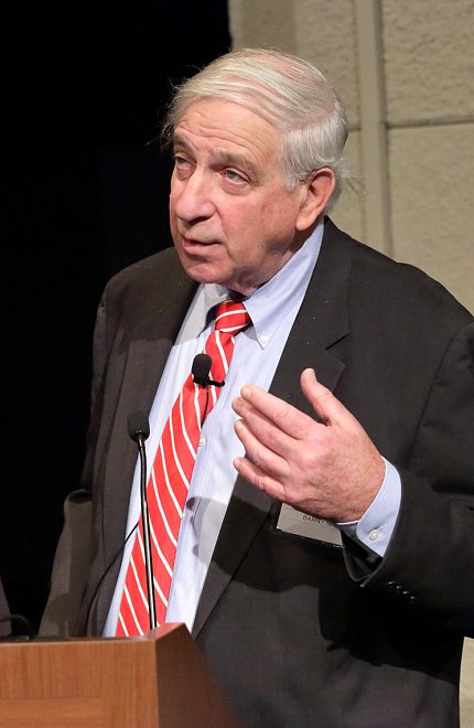 Maron speaks at podium