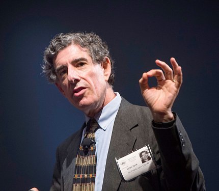 Davidson gestures with his hand.