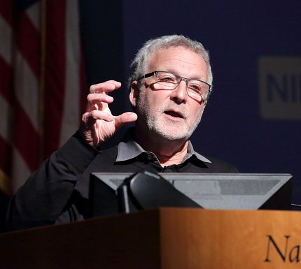 Dr. Basbaum speaks at podium.