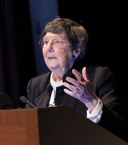 Dr. Holland addresses audience.