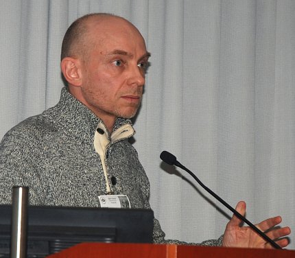 Cecchi speaks at podium