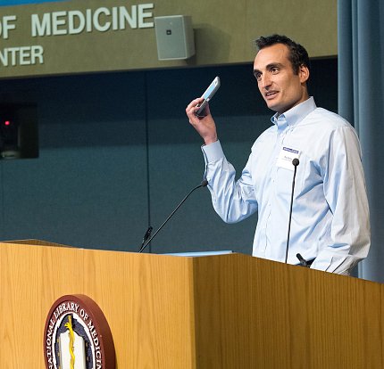 Dr. Dorsey holds up a phone