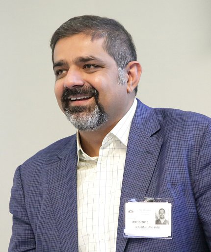Dr. Karim Lakhani speaks at podium