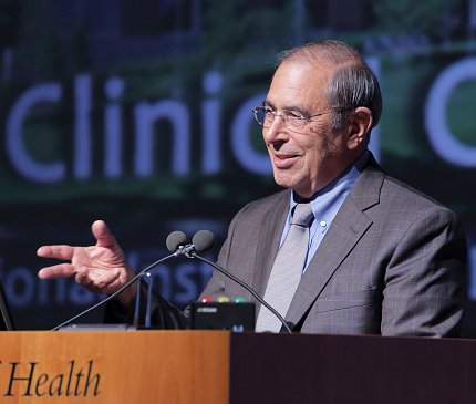 Dr. Gallin speaks onstage.