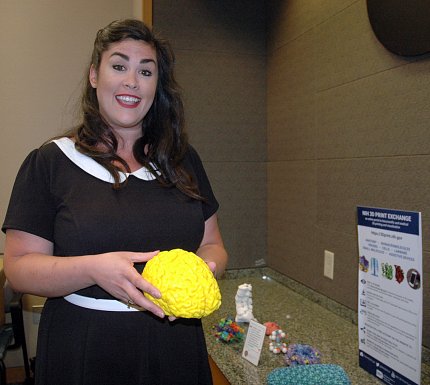 McCarthy holds a model brain.