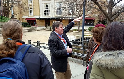 Schelp leads a tour historic Carolina Theater