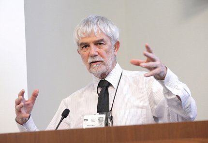 Dr. Peter Murray-Rust gestures with his arms