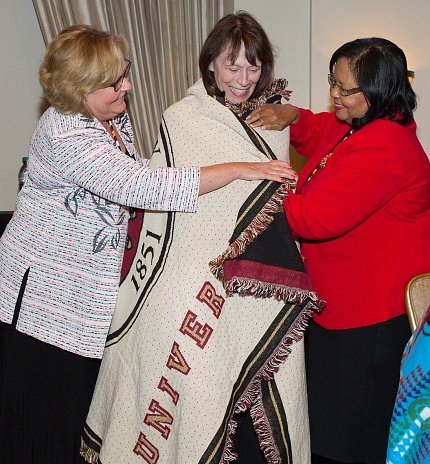 Grady receives a blanket that she wraps around herself