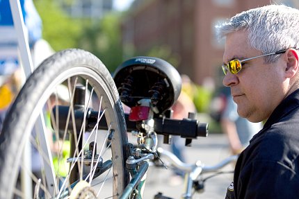 Butchko repairs a bicycle. 