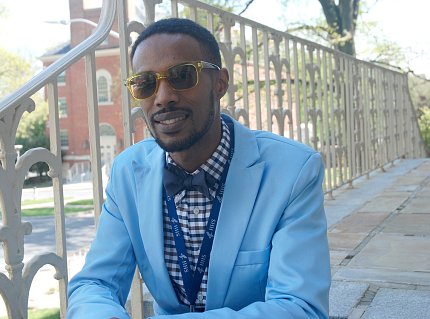 Flood sits on stairs.