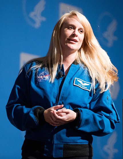 Dr. Rubins, wearing her blue NASA uniform