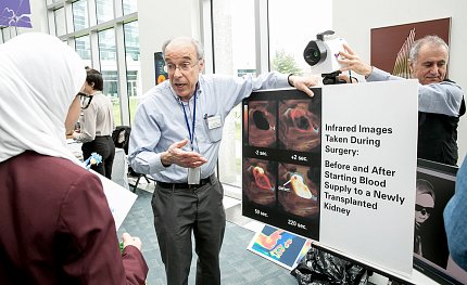 Eden explains a concept to a student