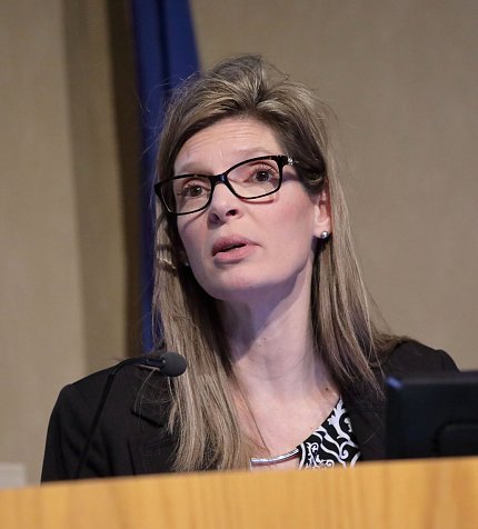 Dr. McKellar speaks at podium.