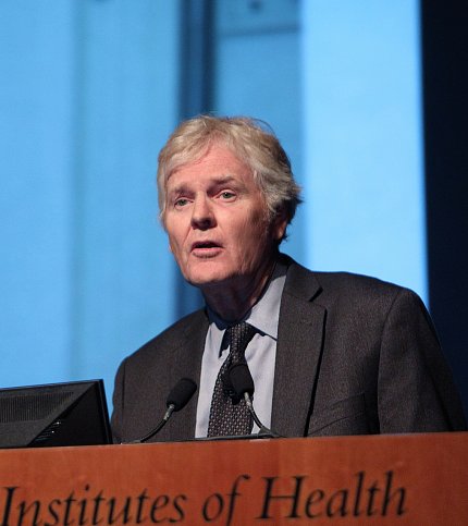 Dr. Young speaks at a podium