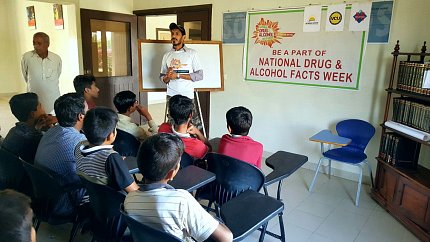 Teens in a Pakistani classroom learn dangers of addiction