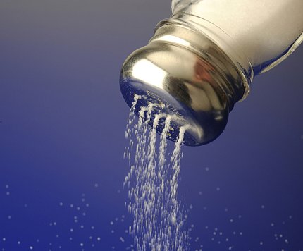 Salt pours from a shaker