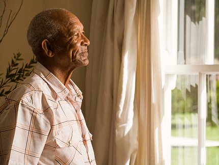 Man looking out the window.