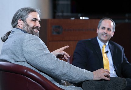 ECI speaker Smith and Lorsch chat informally.