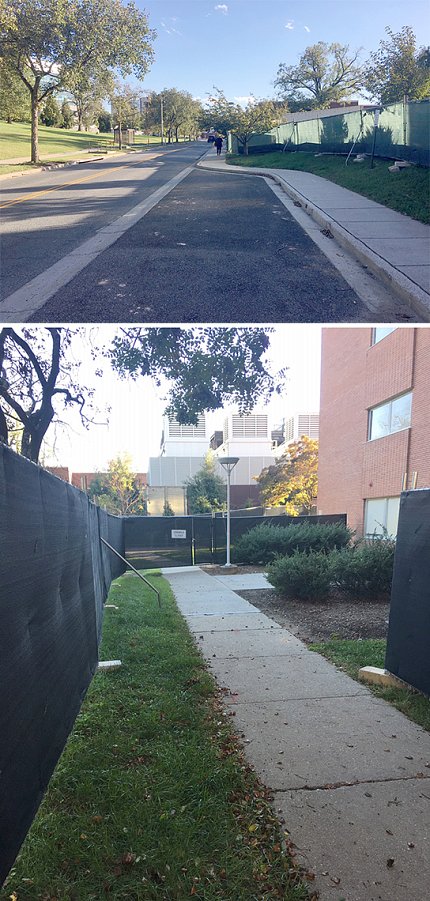Sidewalk with construction fences alongside Bldg. 12A