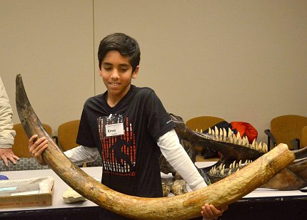 AIS student Kiran Nadanam gets the feel of a real mammoth tusk.