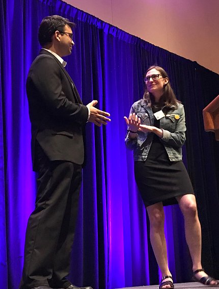 Dr. Sarthak Gupta does a practice interview with Sarah Kaplan onstage.