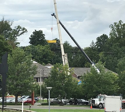 Cranes were used to remove construction materials from the damaged roof.
