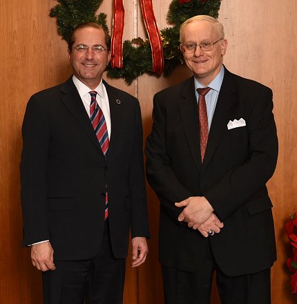 Coppola and Azar stand in front of a wreath