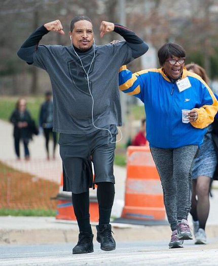 A participant shows off his muscles
