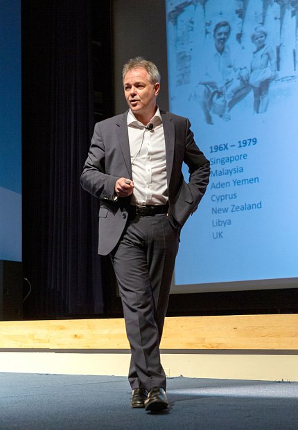 Farrar paces across stage.