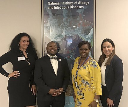 Four members of an NIAID recruitment team