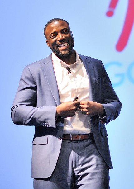 Christian stands smiling