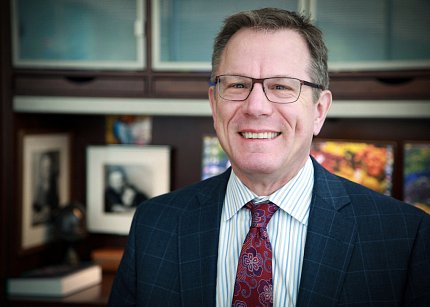 Compton smiles into camera