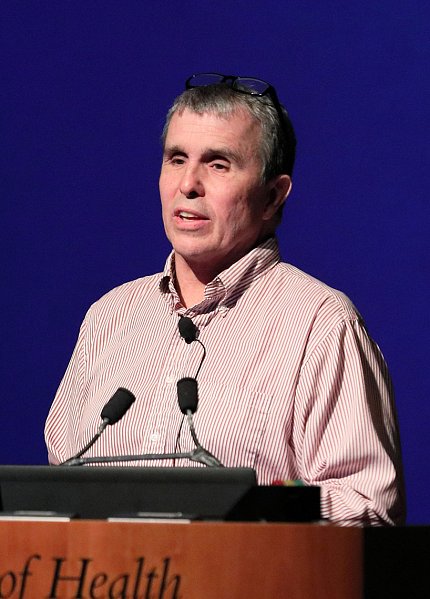 Dr. Betzig speaks on the stage.