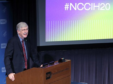 Collins speaks at the podium