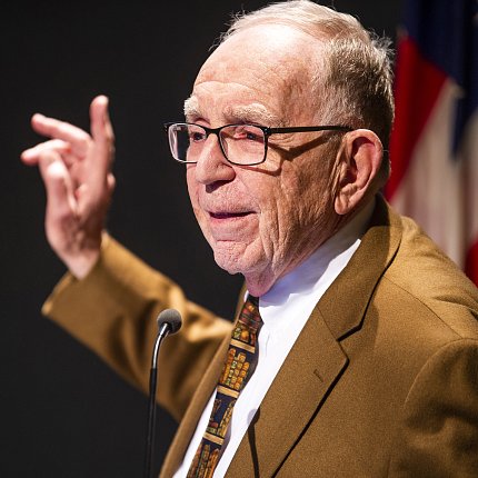 Dr. Edward Feigenbaum with raised hand