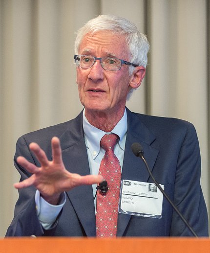 Griffiths speaks at podium