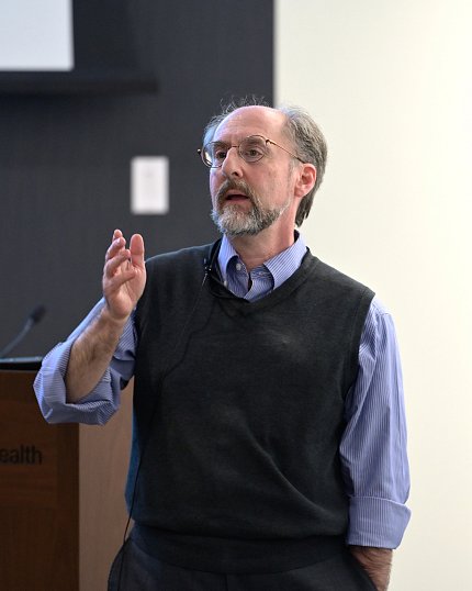 Dr. Giniger talks to the audience.