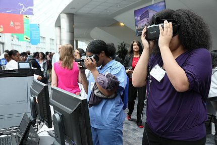 Students try on virtual reality goggles.