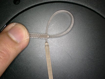 A plastic swab bent to show flexibility