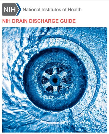 Water circles a drain in an industrial sink