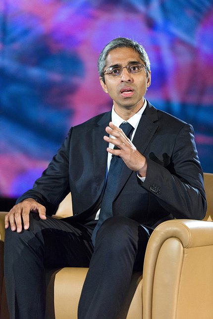 Murthy speaks while sitting in a club chair