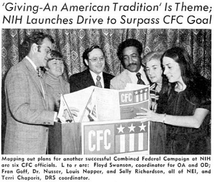 An NIH Record photo features four employees, including Napper, standing around a podium holding a brochure. Above the photo is a headline that reads, "'Giving -An American Tradition' is theme; NIH Launches Drive to Surpass CFC Goal."