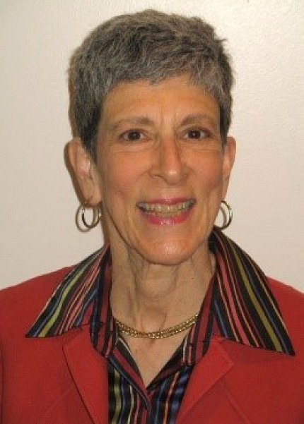 head &amp; shoulders of Greenberg smiling