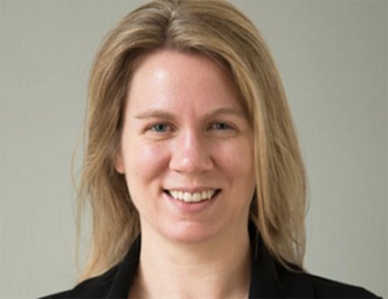 Head shot of a smiling Robinson