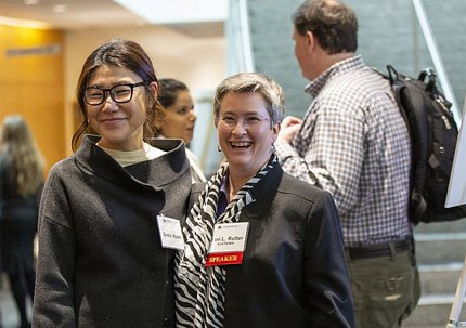 Moon and Rutter smile in the halls of Natcher Conference Center during a break in the day's events.