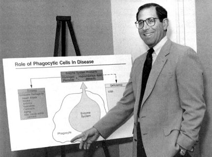 Gallin points to a diagram on a poster